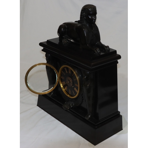 898 - A heavy black slate 8-day striking mantel clock with marble Egyptian sphinx to top, black dial surro... 