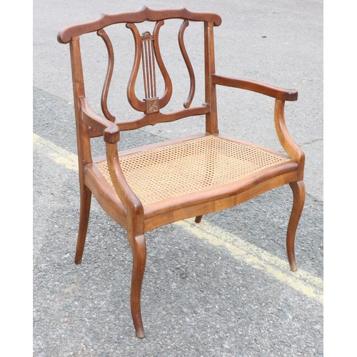 920 - A child's small settee with lyre back, cane seat, on cabriole legs, 60cm wide, 73.5cm high