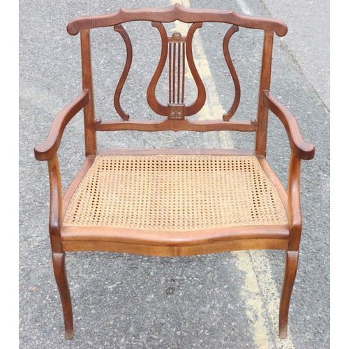 920 - A child's small settee with lyre back, cane seat, on cabriole legs, 60cm wide, 73.5cm high