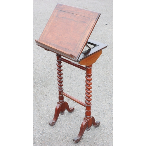 925 - A 19th Century rosewood reading table with hinged top, barley twist supports on splayed legs, 38.5cm... 