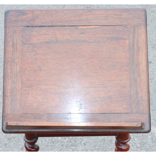 925 - A 19th Century rosewood reading table with hinged top, barley twist supports on splayed legs, 38.5cm... 