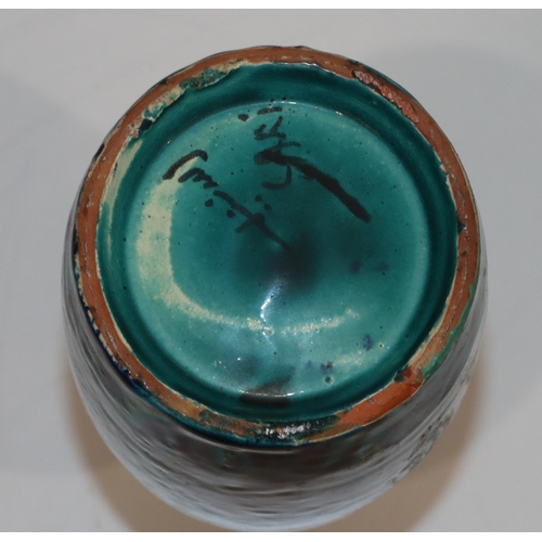 125 - A Safi earthenware round bulbous thin necked bottle on turquoise and blue ground, 14cm high