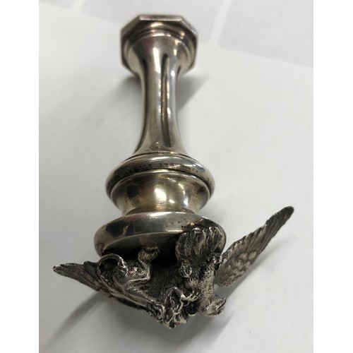 273 - A heavy Continental silver coloured metal desk seal with cast bird and lion motif to top, fluted ste... 