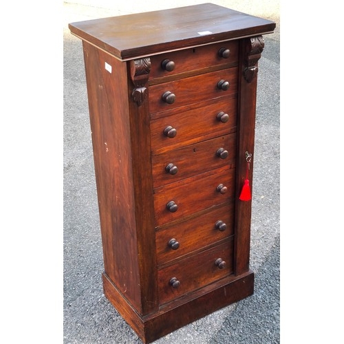 919 - A Victorian walnut Wellington chest with 7 graduated drawers with wood knob handles and lockable sid... 