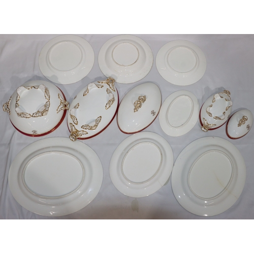 6001 - A Worcester dinner service on white ground with red rims and gilt key pattern decoration, all mounte... 