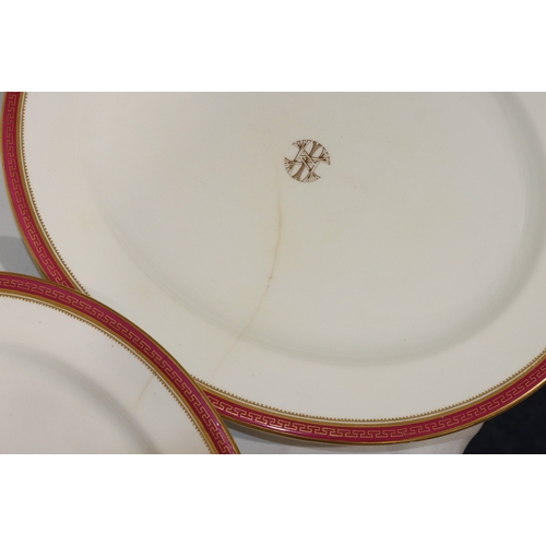 6001 - A Worcester dinner service on white ground with red rims and gilt key pattern decoration, all mounte... 