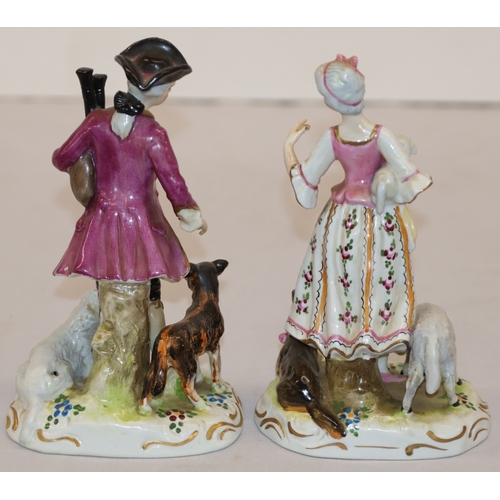 19 - A pair of Continental figures of a lady and gentleman with dog and sheep at their feet, 16.5cm high