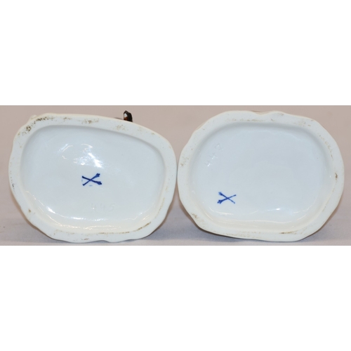 19 - A pair of Continental figures of a lady and gentleman with dog and sheep at their feet, 16.5cm high