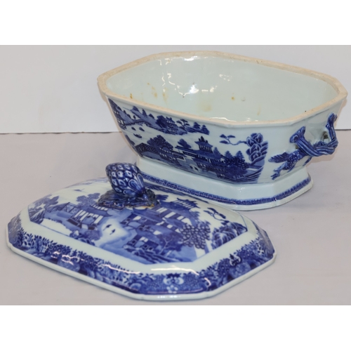 25 - A blue and white rectangular 2-handled lidded tureen with figure, river landscape and building decor... 