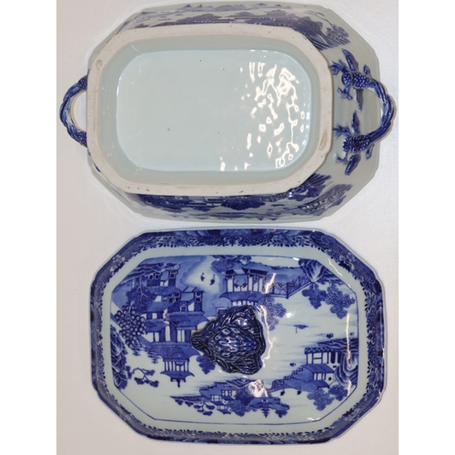 25 - A blue and white rectangular 2-handled lidded tureen with figure, river landscape and building decor... 