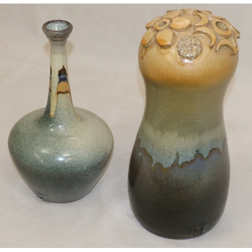 38 - A Studio Pottery round bulbous vase with raised floral and moon motifs, indistinctly signed, 31cm hi... 