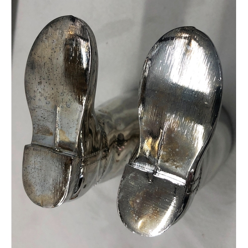 6011 - A  pair of 20th century Grenadier silver plated hunting boots shot measures with white liners. Marke... 