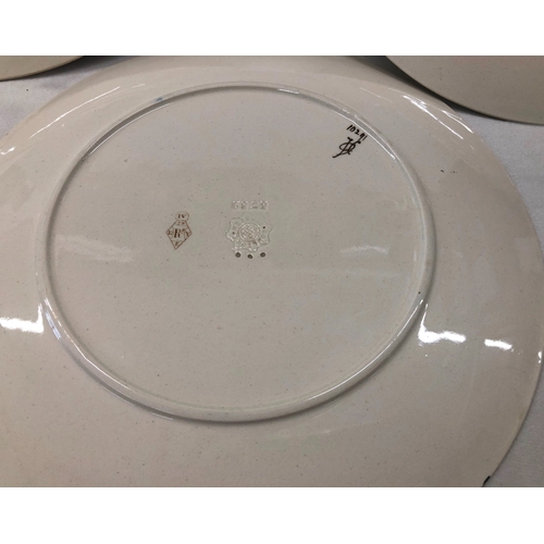 6021 - A set of Doulton Burselm floral patterned plates with gilt detail and 2 cake stands.