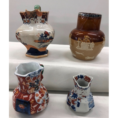 6022 - A Doulton Lambeth jug with silver rim, No. 8317, 17cm high, a small Mason's jug, 9.5cm high and 2 ot... 