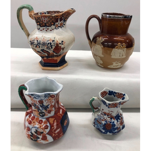 6022 - A Doulton Lambeth jug with silver rim, No. 8317, 17cm high, a small Mason's jug, 9.5cm high and 2 ot... 