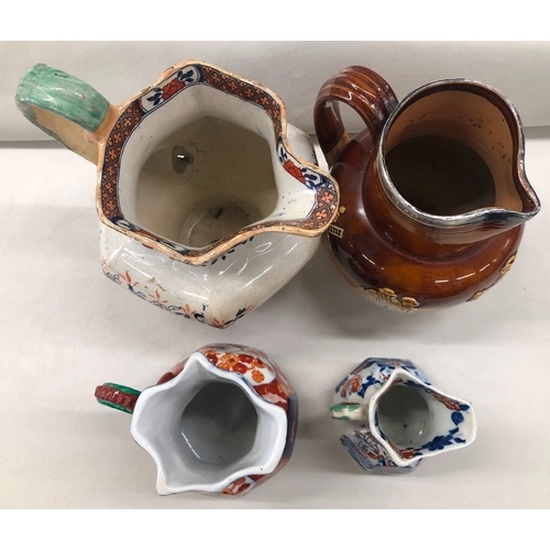 6022 - A Doulton Lambeth jug with silver rim, No. 8317, 17cm high, a small Mason's jug, 9.5cm high and 2 ot... 