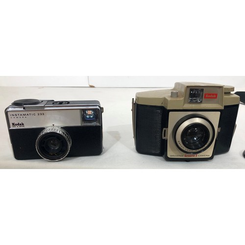 6029 - A Koroll II camera with Bencini 1:8 lens and case, a Kodak Instamatic 233 camera, cased, a Kodak Bro... 