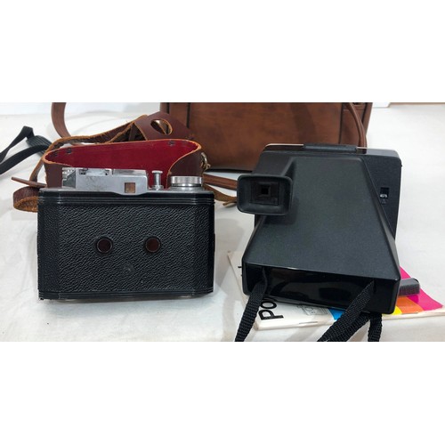 6029 - A Koroll II camera with Bencini 1:8 lens and case, a Kodak Instamatic 233 camera, cased, a Kodak Bro... 