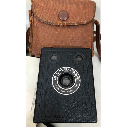 6029 - A Koroll II camera with Bencini 1:8 lens and case, a Kodak Instamatic 233 camera, cased, a Kodak Bro... 