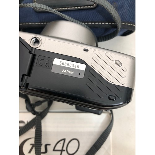 6029 - A Koroll II camera with Bencini 1:8 lens and case, a Kodak Instamatic 233 camera, cased, a Kodak Bro... 