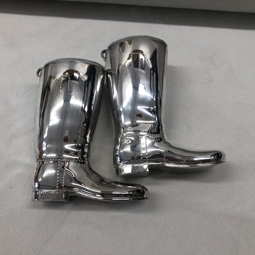 6011 - A  pair of 20th century Grenadier silver plated hunting boots shot measures with white liners. Marke... 