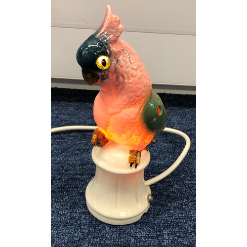 6039 - A pair of reproduction Majolica candlesticks in the form of cockerels, 23cm high and cockatoo lamp, ... 