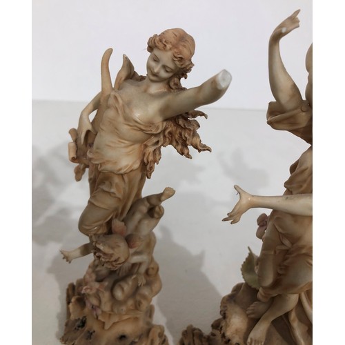 6048 - A Lladro figure of a girl holding a chicken and basket, 24cm high, another Lladro style figure of a ... 