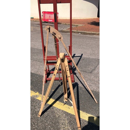 6050 - A large easel, 147cm high, 54.5cm wide, 48cm deep and 2 other easels (both a/f). (3)