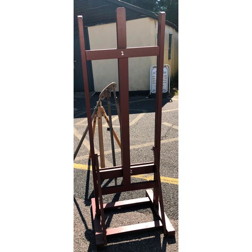 6050 - A large easel, 147cm high, 54.5cm wide, 48cm deep and 2 other easels (both a/f). (3)