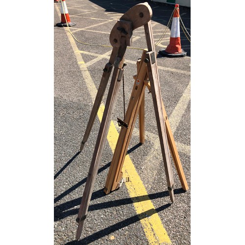 6050 - A large easel, 147cm high, 54.5cm wide, 48cm deep and 2 other easels (both a/f). (3)