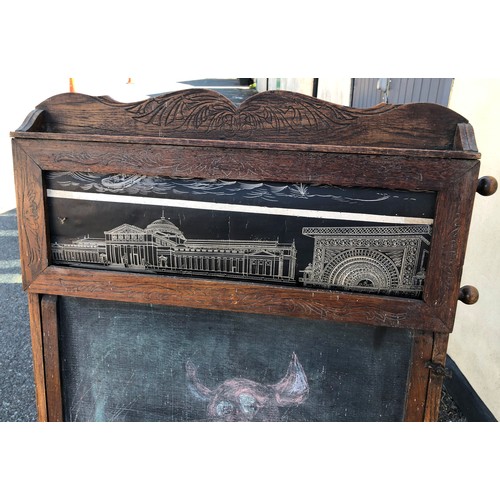 6051 - A child's easel 117cm high, 58cm wide. 48cm deep overall, with chalkboard, interior storage section ... 