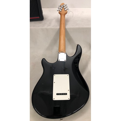 6060 - A Peavey electric guitar no. I 1093755 with a Matrix SR-4000 Auto Chromatic tuner, cables, zipped ca... 