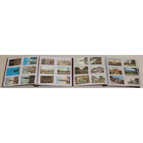 605 - 2 large albums containing vintage postcards, 