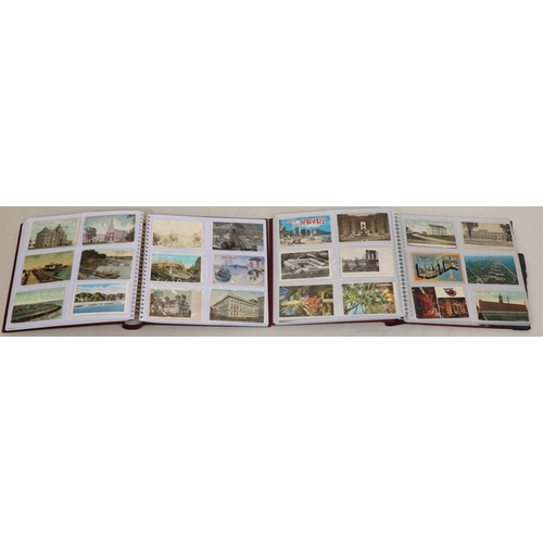 605 - 2 large albums containing vintage postcards, 