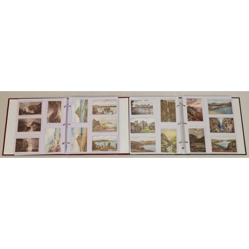 606 - 2 large albums of topographical artistic coloured cards, by Raphael Tuck, etc.