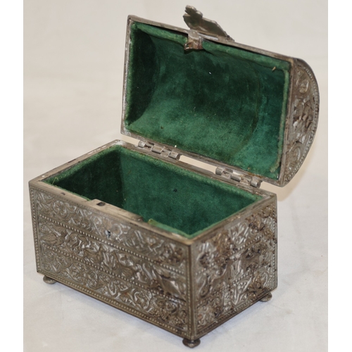 618 - A metal dome topped trinket box casket, hinged lid with allover raised figure, bird, animal and scro... 
