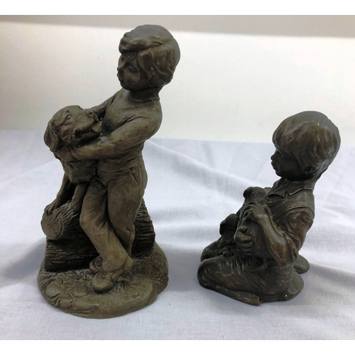 6102 - A resin composition figure of a boy and dog, 16.5cm high and a similar figure of a kneeling boy and ... 