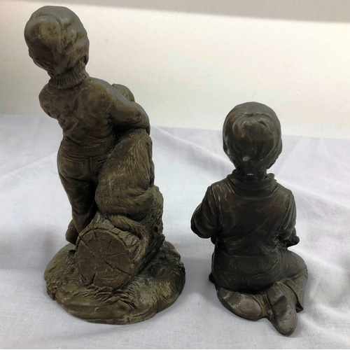 6102 - A resin composition figure of a boy and dog, 16.5cm high and a similar figure of a kneeling boy and ... 