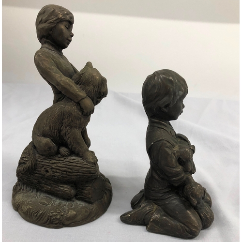 6102 - A resin composition figure of a boy and dog, 16.5cm high and a similar figure of a kneeling boy and ... 