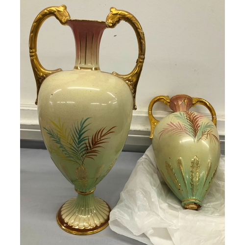 6161 - A pair of 2-handled lidded vases, 40cm high (both a/f)