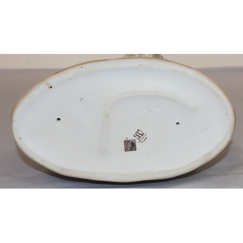 61 - A Nao group of standing lady and daughter on oval base, 38cm high