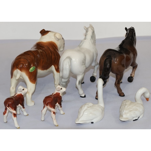 63 - A Beswick CH.Bashford British mascot, 14cm high, 2 Beswick figures of horses, 2 Beswick calves and 2... 