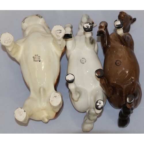 63 - A Beswick CH.Bashford British mascot, 14cm high, 2 Beswick figures of horses, 2 Beswick calves and 2... 
