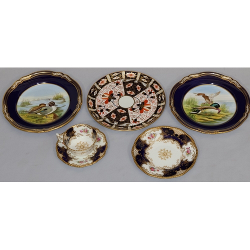 65 - A Coalport trio on white and blue ground with multi-coloured floral, leaf and gilt decoration, compr... 