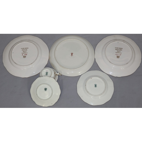 65 - A Coalport trio on white and blue ground with multi-coloured floral, leaf and gilt decoration, compr... 