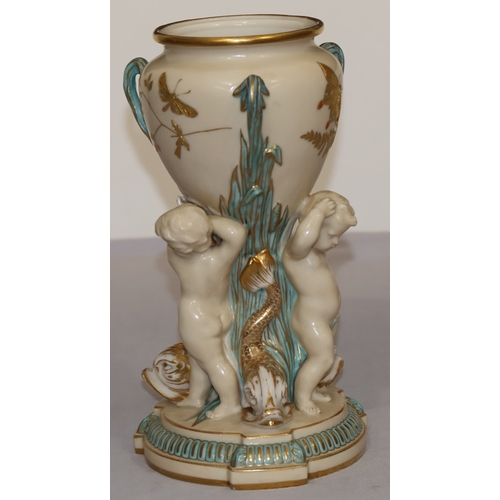 70 - A Copeland round bulbous shaped 3-handled vase supported by 3 cupids and gilt fish motifs, on circul... 