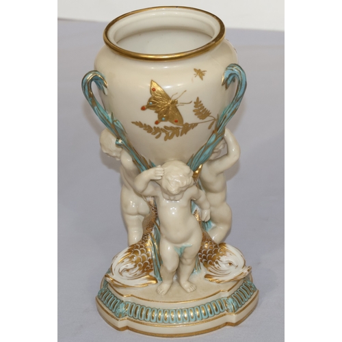 70 - A Copeland round bulbous shaped 3-handled vase supported by 3 cupids and gilt fish motifs, on circul... 