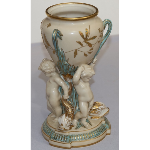 70 - A Copeland round bulbous shaped 3-handled vase supported by 3 cupids and gilt fish motifs, on circul... 