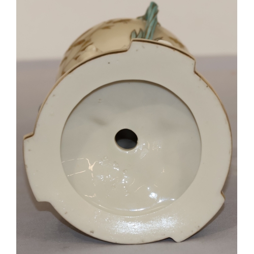 70 - A Copeland round bulbous shaped 3-handled vase supported by 3 cupids and gilt fish motifs, on circul... 