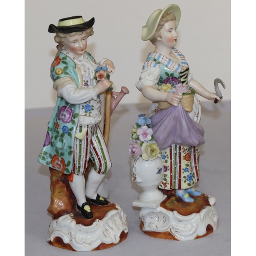 72 - A pair of Continental china figures of farming gentleman and wife holding implements and encrusted f... 